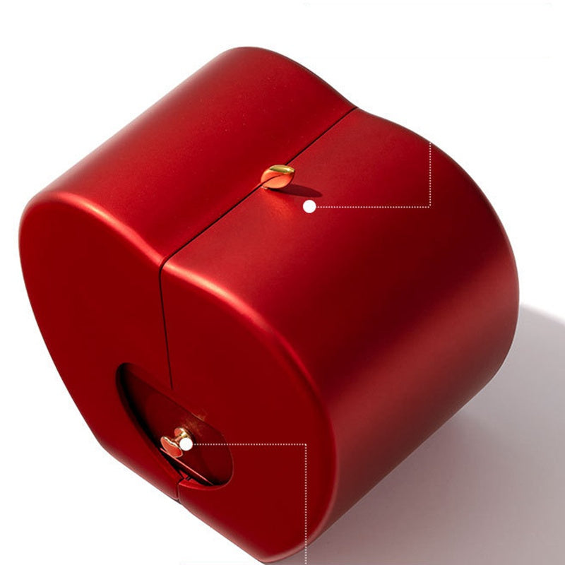Closed red apple gift box viewed from the side, showing the hidden drawer seam and gold clasp